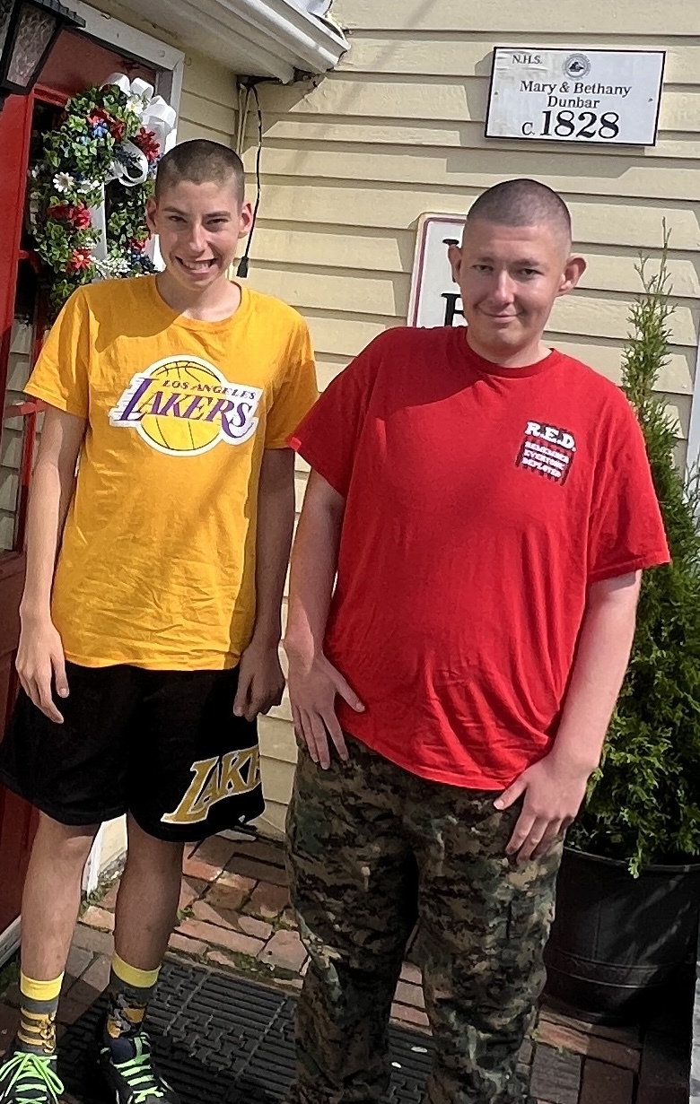 two teenage boys smiling